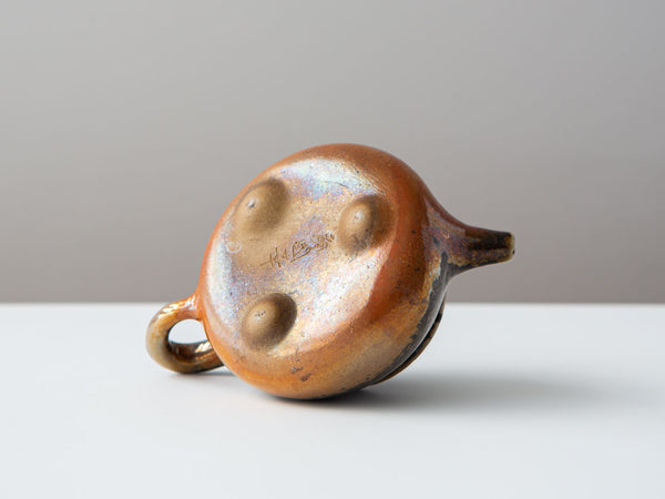 Shipiao. Bottom view, with artist signature, 3 feet, and gold tones.