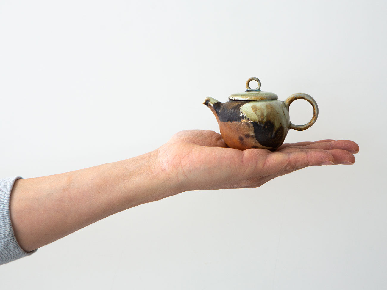 Abstract, Var. 1. Teapot in hand to show relative size.
