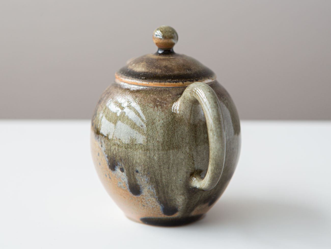 Honey. Rear of teapot. Beautiful glaze crazing, coloration, and running drips.