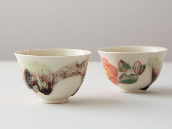 Hand-painted porcelain tea cups by Erin Louis Clancy.